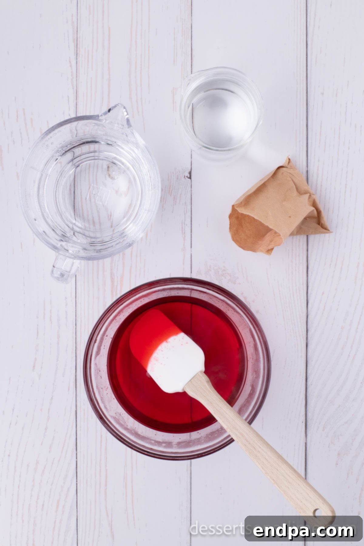 Cherry jello mixture in a bowl.