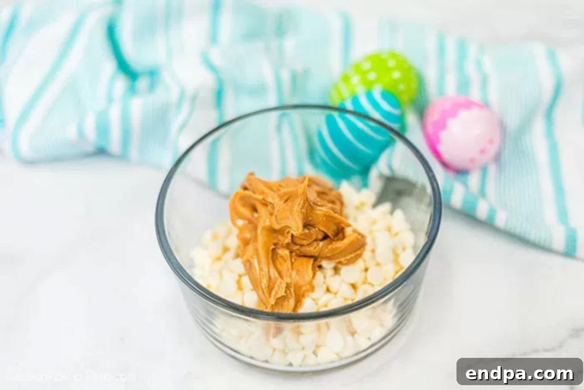 Mixing bowl with melted peanut butter and white chocolate mixture.
