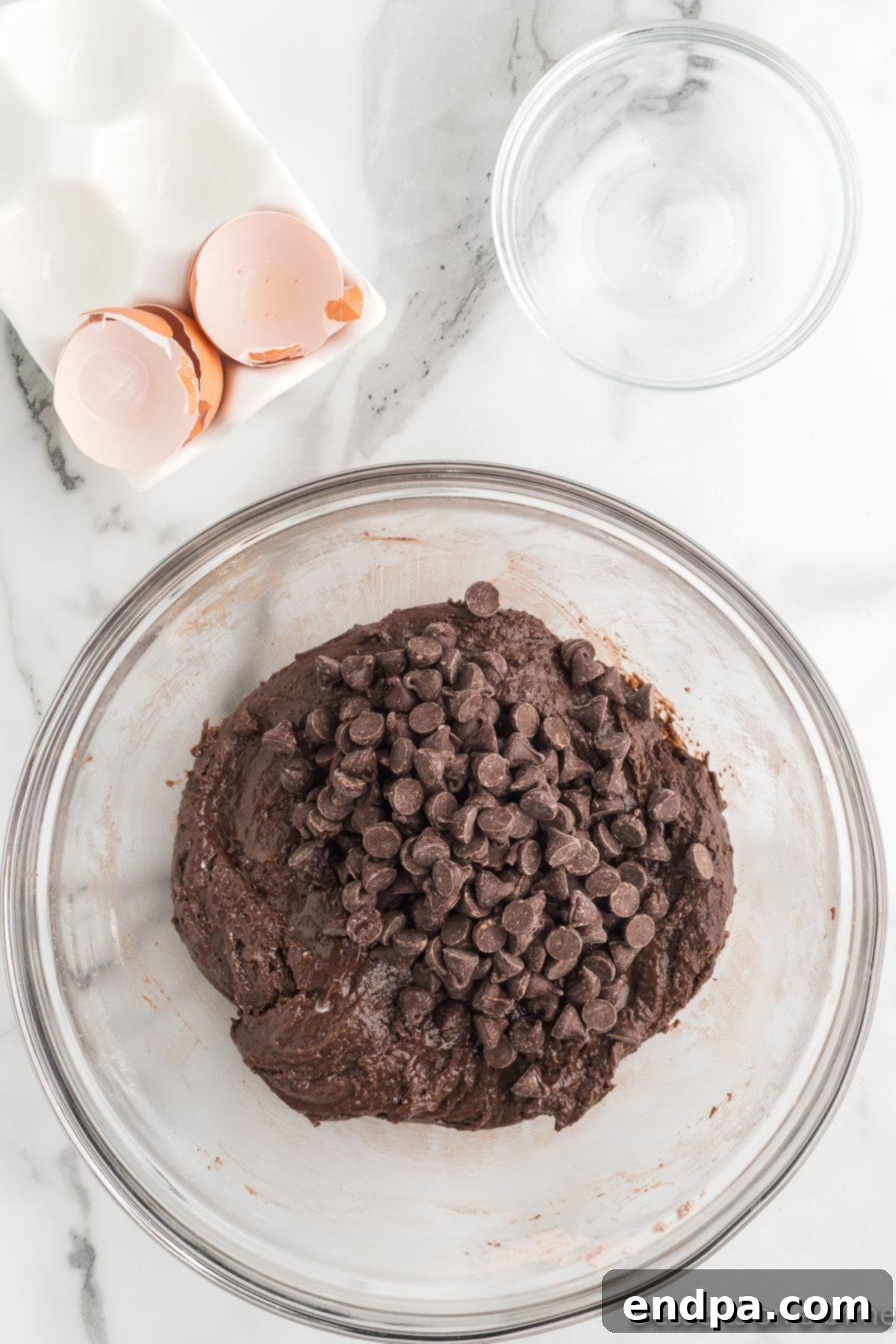 Fudgy Chocolate Cake Mix Cookies 6 Chocolate chips added to bowl.