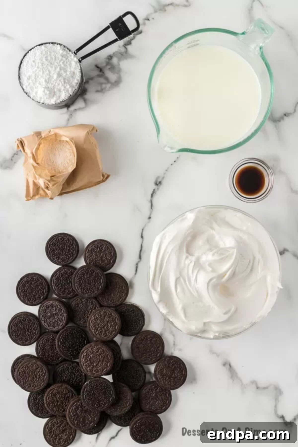 Main ingredients laid out for cream cheese-free Dirt Cake: milk, whipped topping, vanilla pudding mix, vanilla extract, Oreo cookies, and powdered sugar.