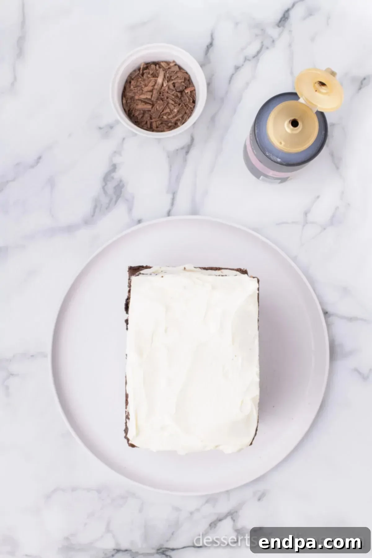 Whipped cream on top of brownies.