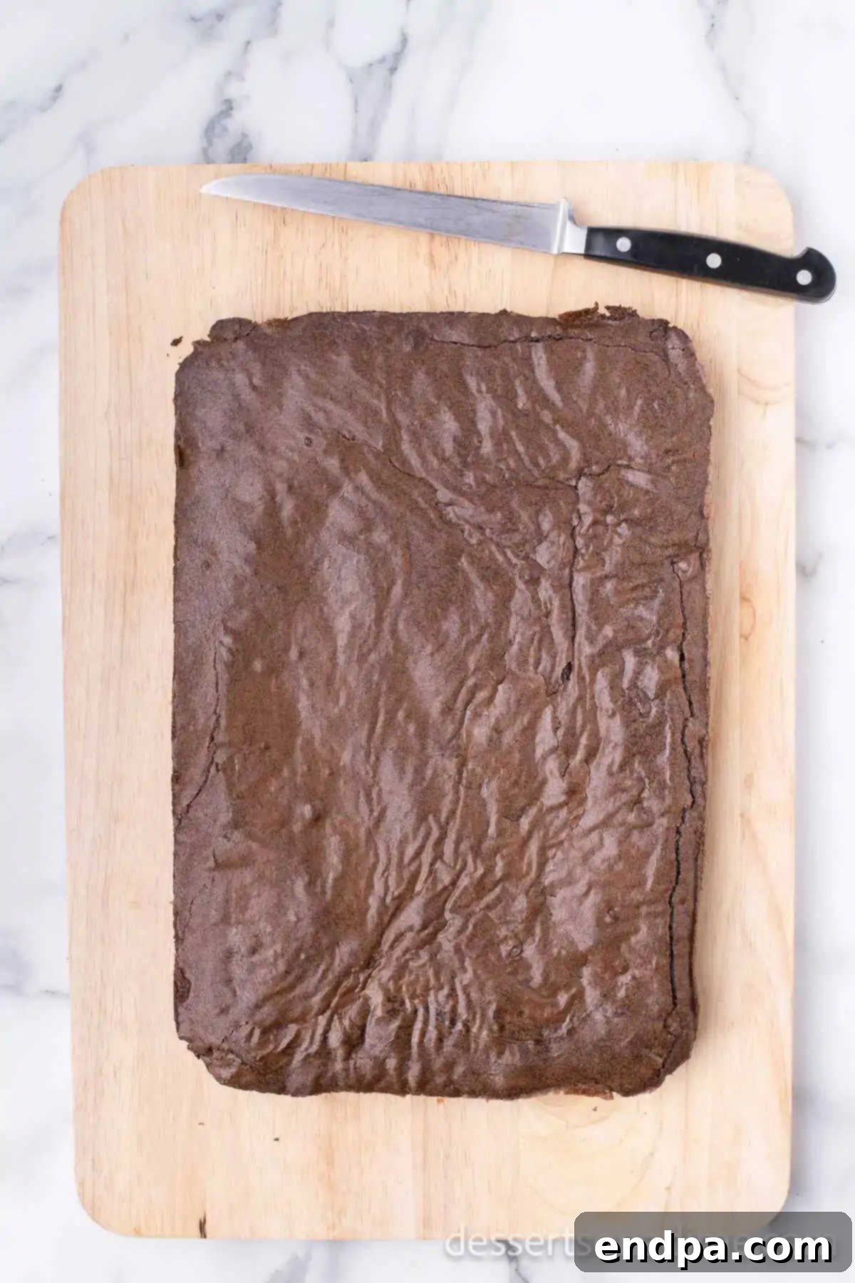 Brownies on cutting board.