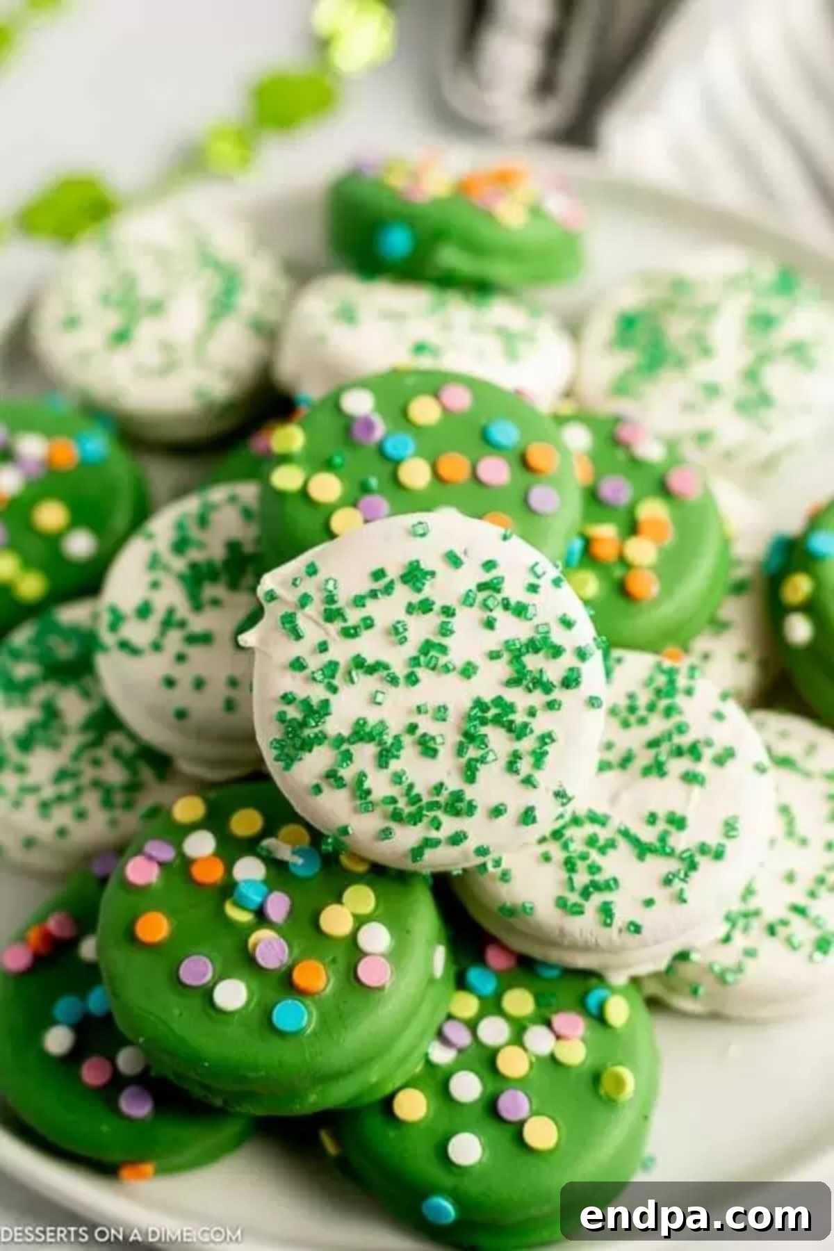 Pot O' Gold Chocolate Oreos 2 St. Patrick's Day Chocolate Covered Oreos on a platter, ready to be enjoyed.