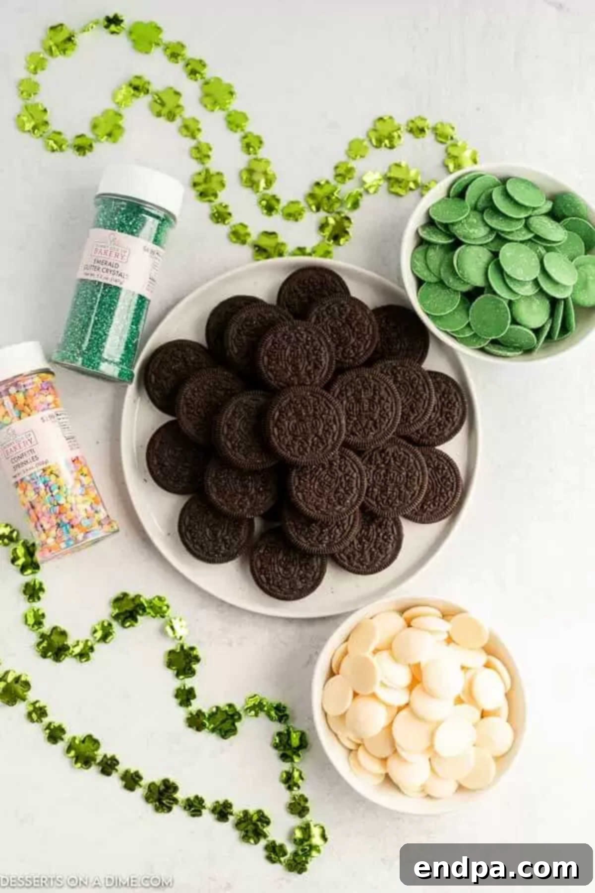 Pot O' Gold Chocolate Oreos 3 Ingredients for St. Patrick's Day Chocolate Covered Oreos: candy melts, Oreo cookies, and sprinkles.