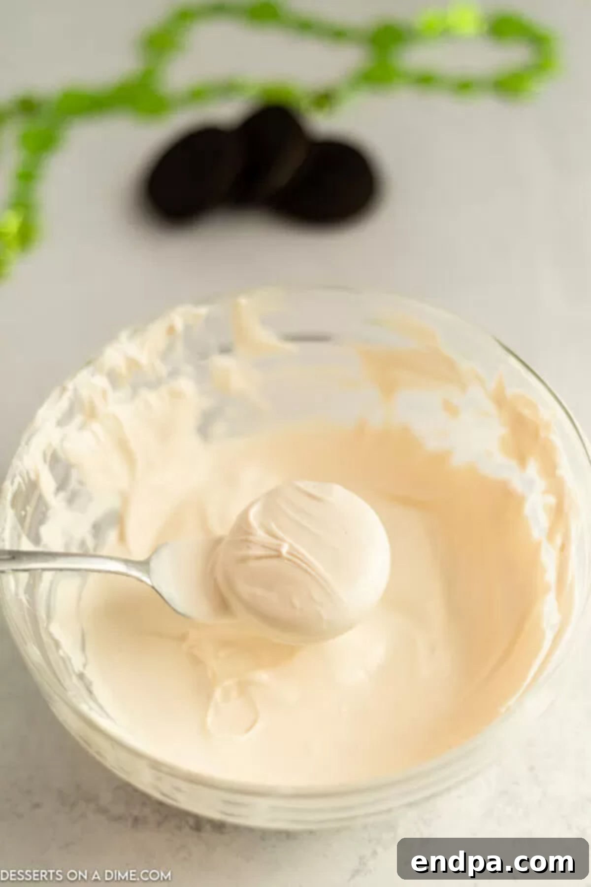 Pot O' Gold Chocolate Oreos 4 Melted candy melts in a bowl, ready for dipping.