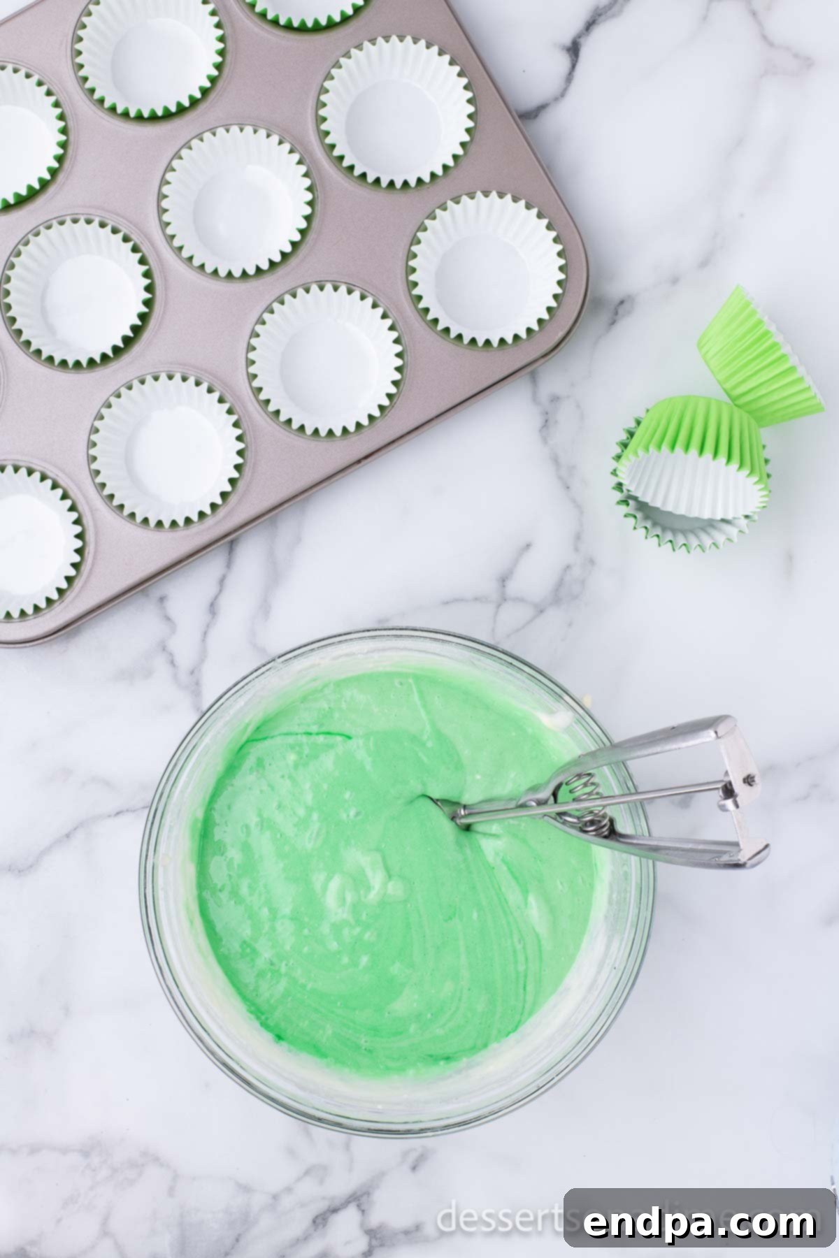 Lucky Green Cupcake Delights 4 Green cupcake batter in a mixing bowl, ready to be portioned.