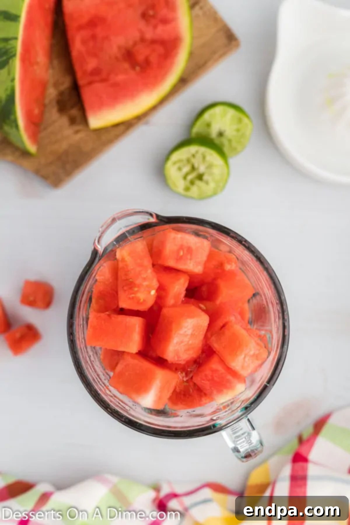 Refreshing Watermelon Ice Pops 4 Freshly cut watermelon cubes and a lime waiting to be blended into a refreshing puree.