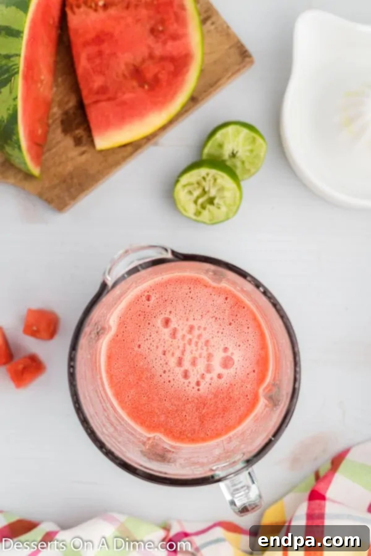 Refreshing Watermelon Ice Pops 5 The blender container filled with the vibrant pink watermelon and lime mixture, being blended to a smooth consistency.