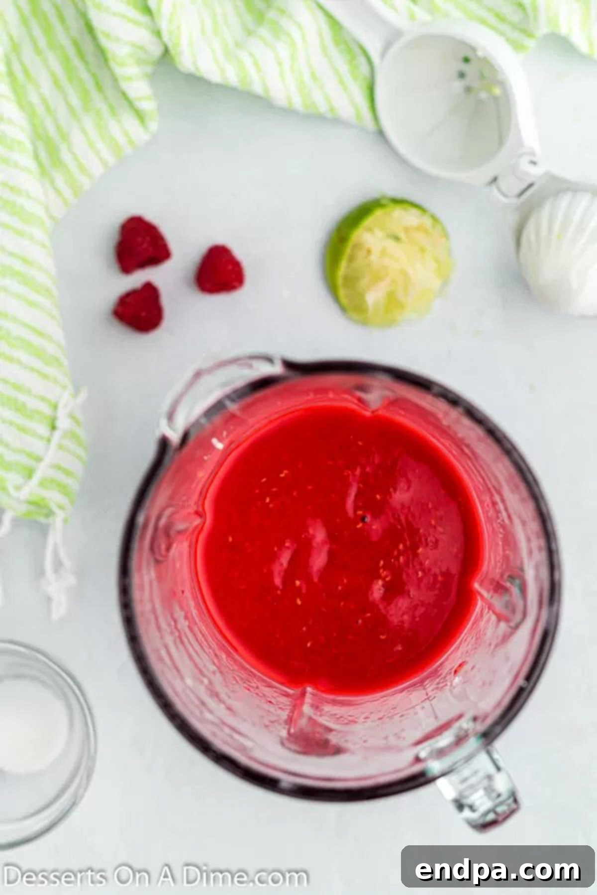 Bursting Berry Bliss: Homemade Raspberry Pops 4 Ingredients blended together.