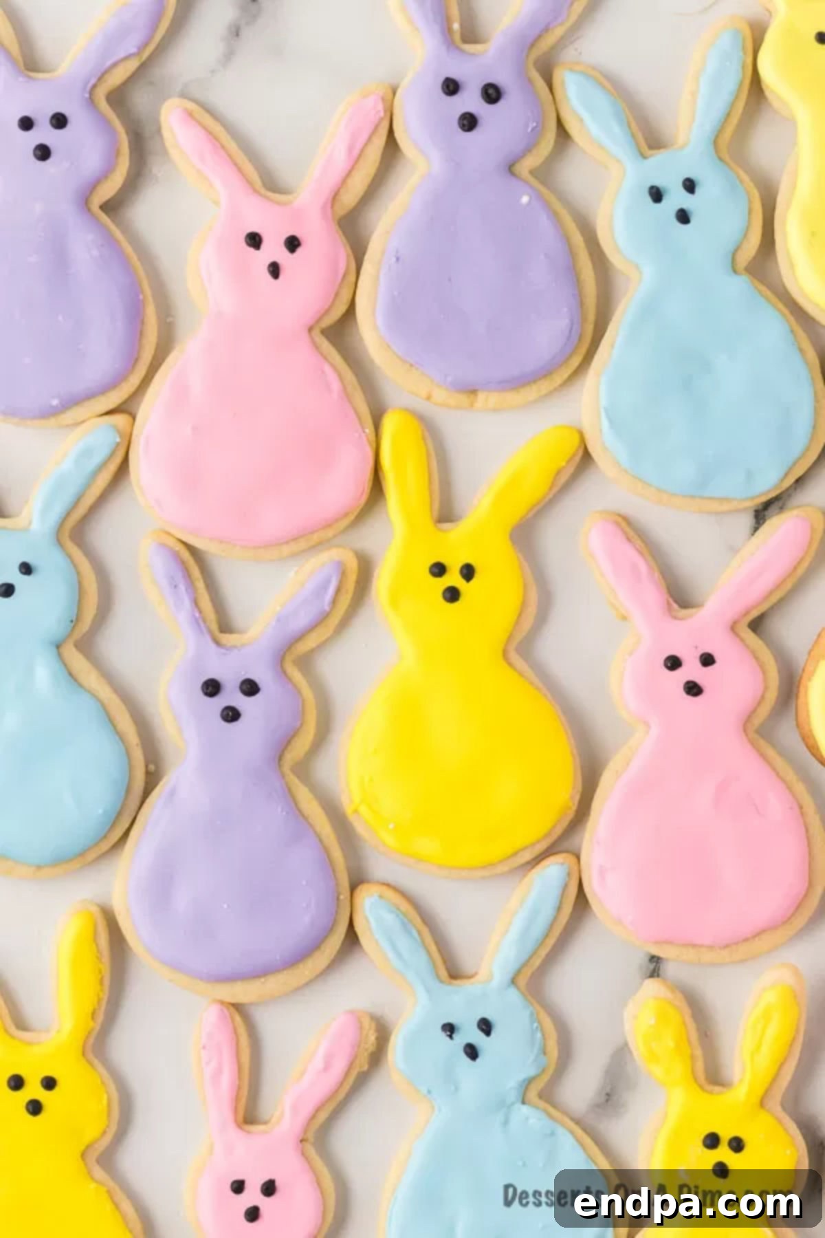 Hoppy Easter Cookie Creations 14 A collection of beautifully decorated Easter bunny cookies arranged on a kitchen counter, ready to be enjoyed.