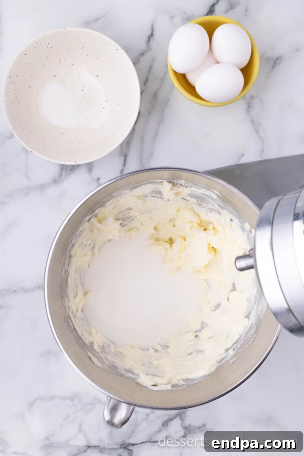 Hoppy Easter Cookie Creations 4 Mixing bowl with softened butter and granulated sugar, ready for creaming.