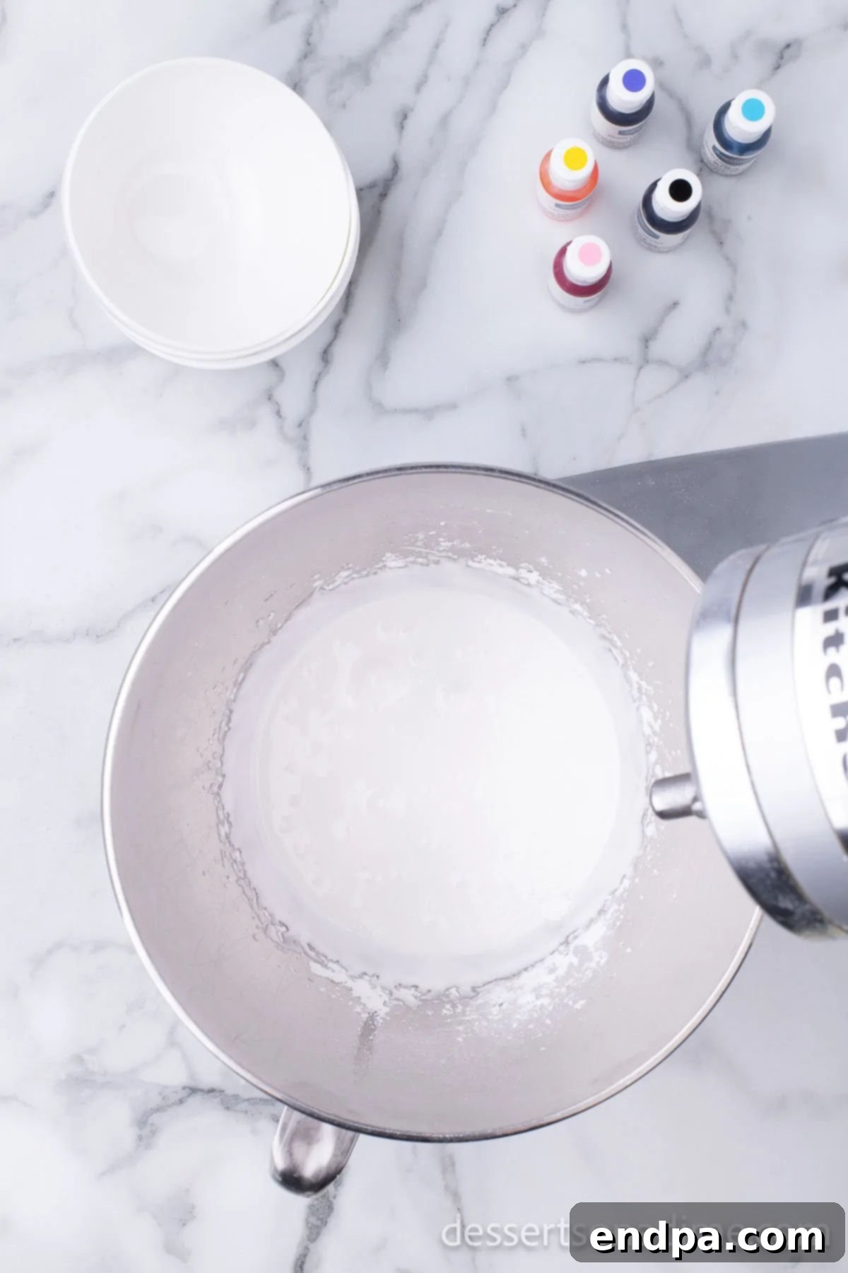 Hoppy Easter Cookie Creations 10 A mixing bowl with royal icing ingredients being combined at medium speed.