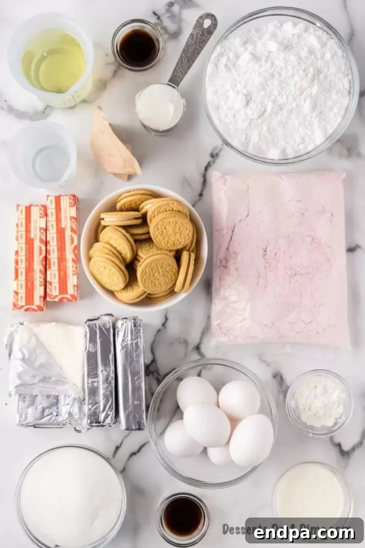 Decadent Strawberry Shortcake Cheesecake 3 A flat lay of all the essential ingredients needed for the Strawberry Shortcake Cheesecake recipe: cake mix, golden Oreo cookies, butter, cream cheese, eggs, powdered sugar, oil, and vanilla extract.