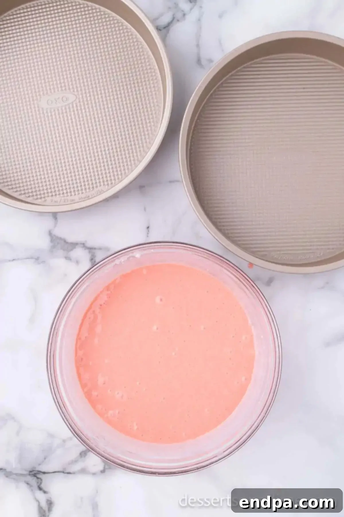 Decadent Strawberry Shortcake Cheesecake 4 Strawberry cake batter in a mixing bowl, ready for baking.