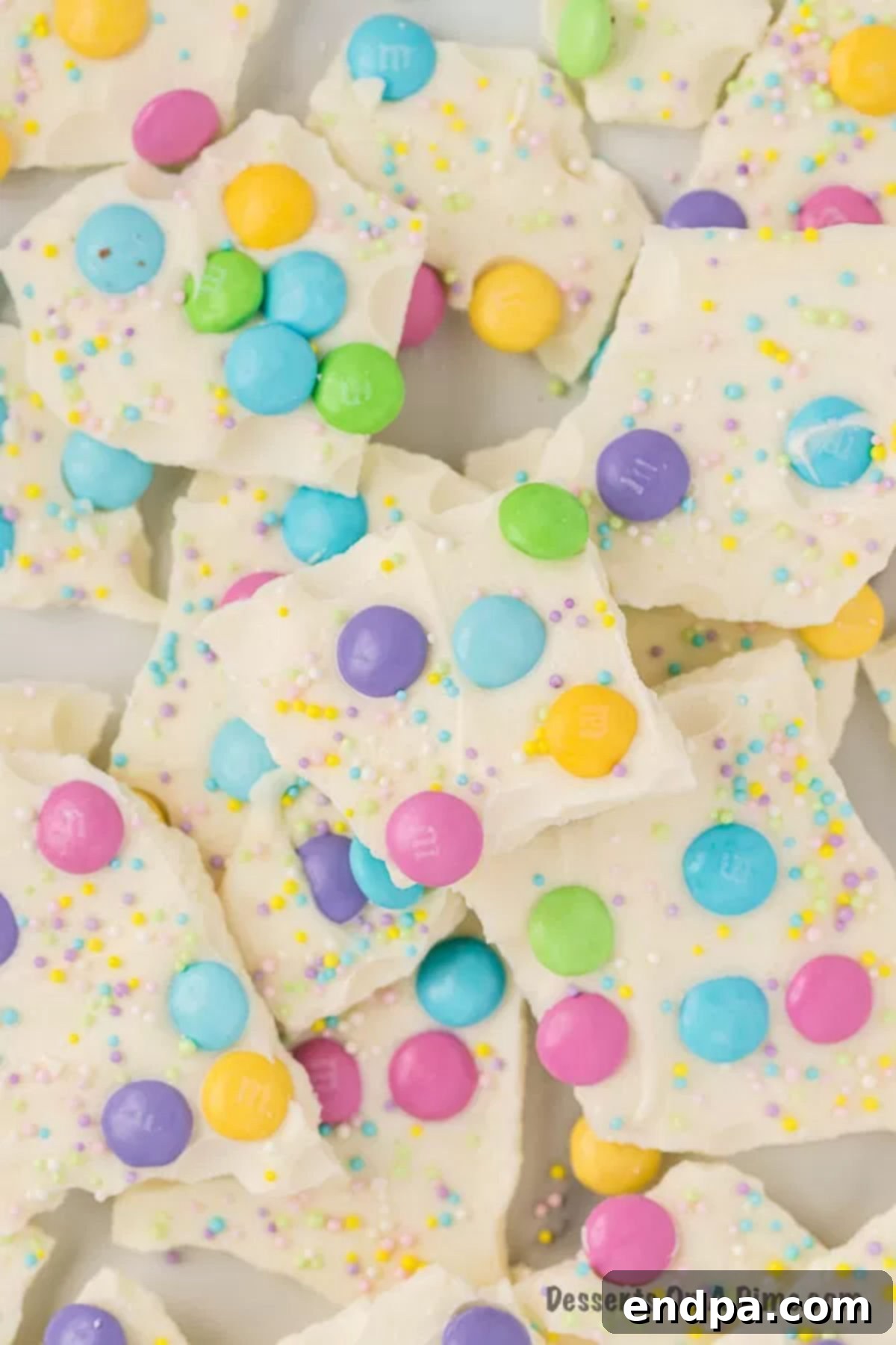 Close up image of Easter White Chocolate Bark with spring color candy and sprinkles. 
