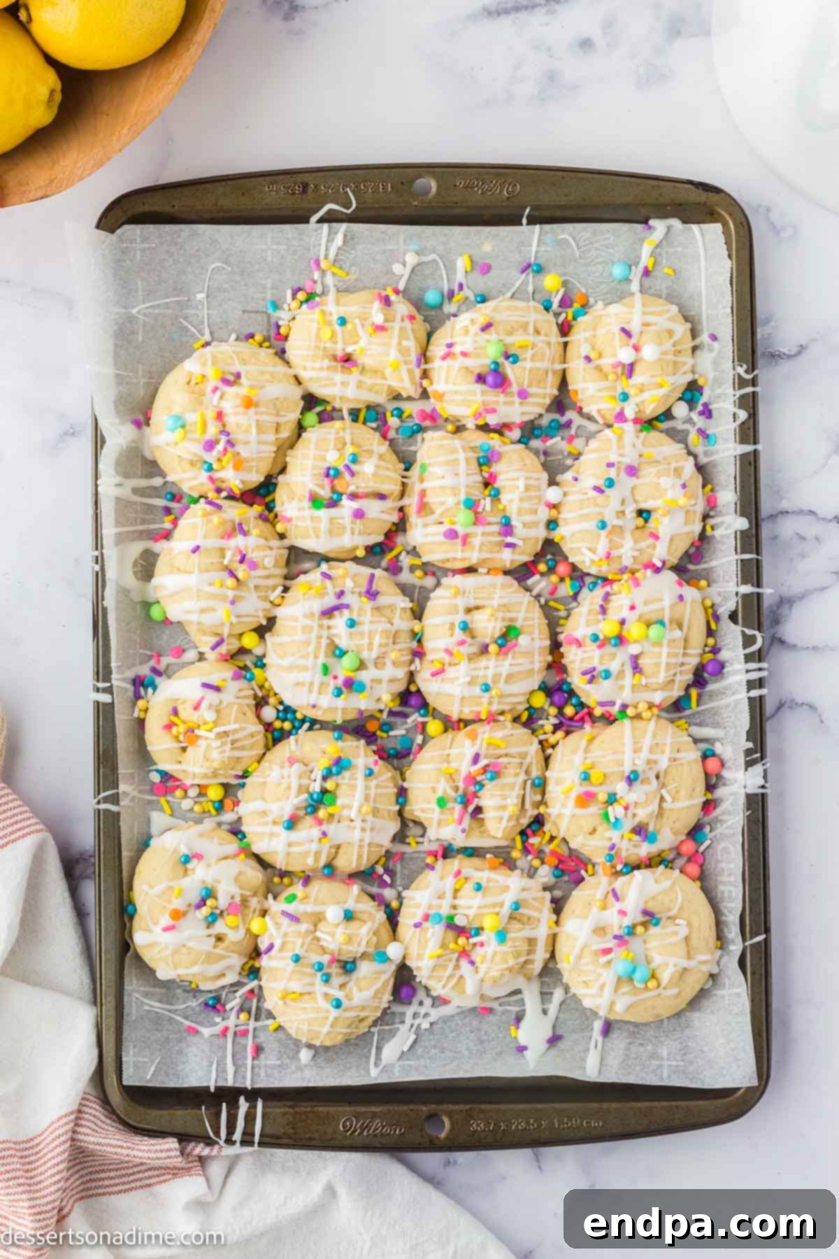 Cookies topped with glaze and sprinkles. 