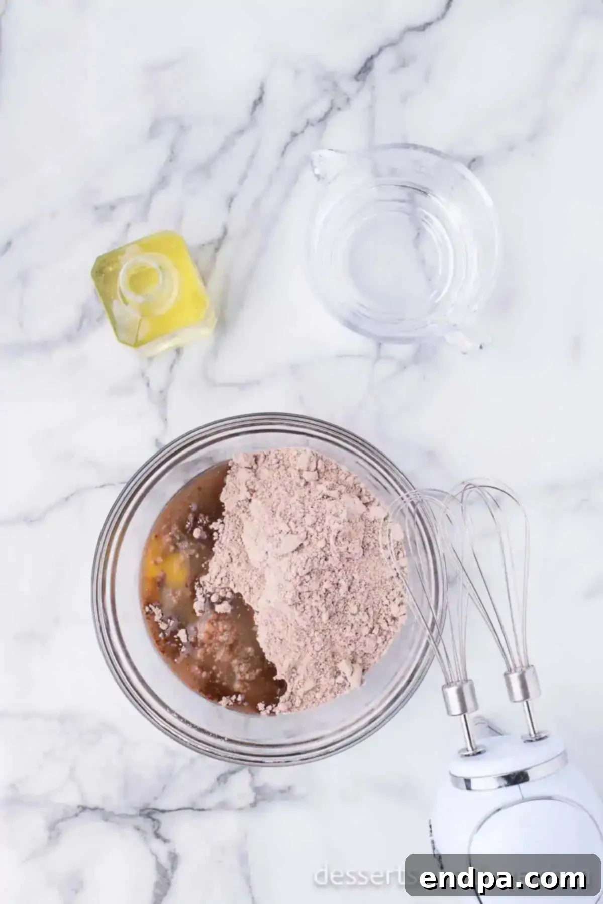Brownie mix ingredients combined in a mixing bowl, ready for baking.
