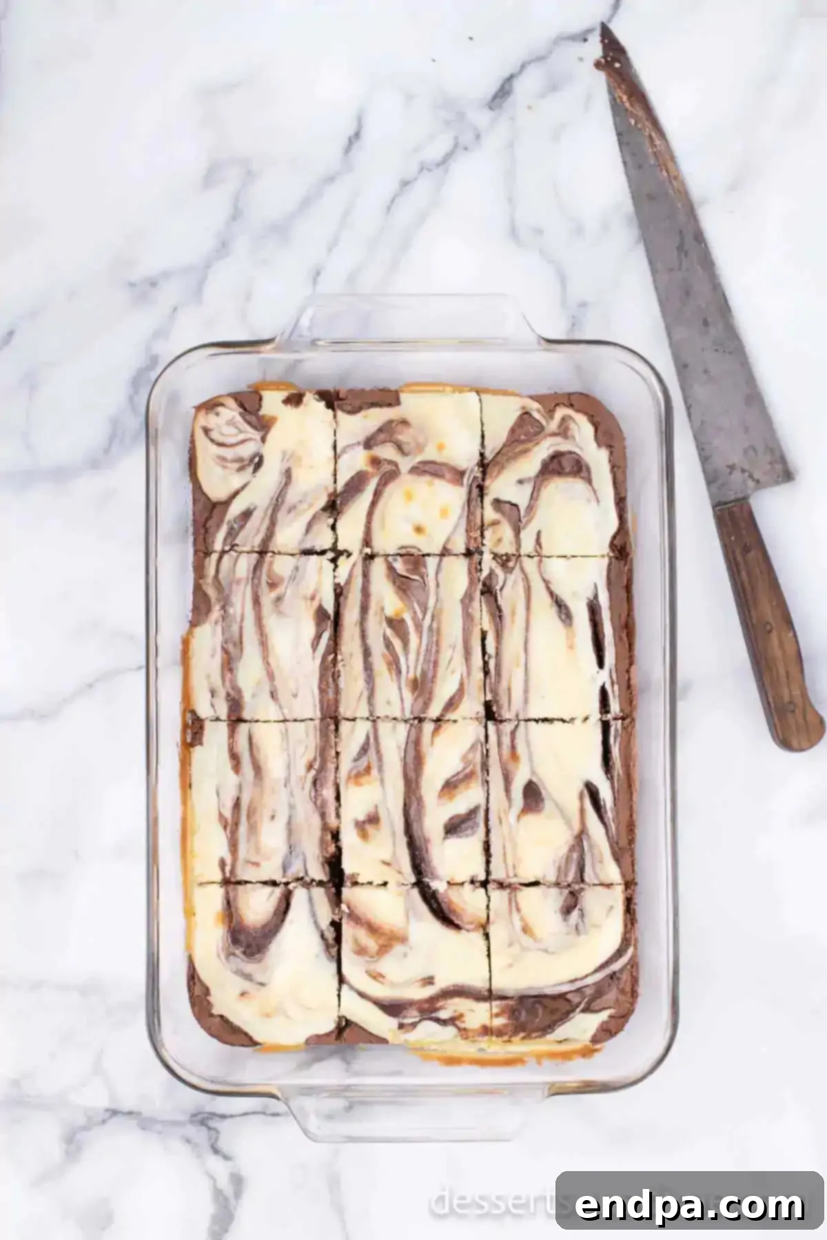 Baked cream cheese brownies, cooled and neatly cut into individual serving squares.