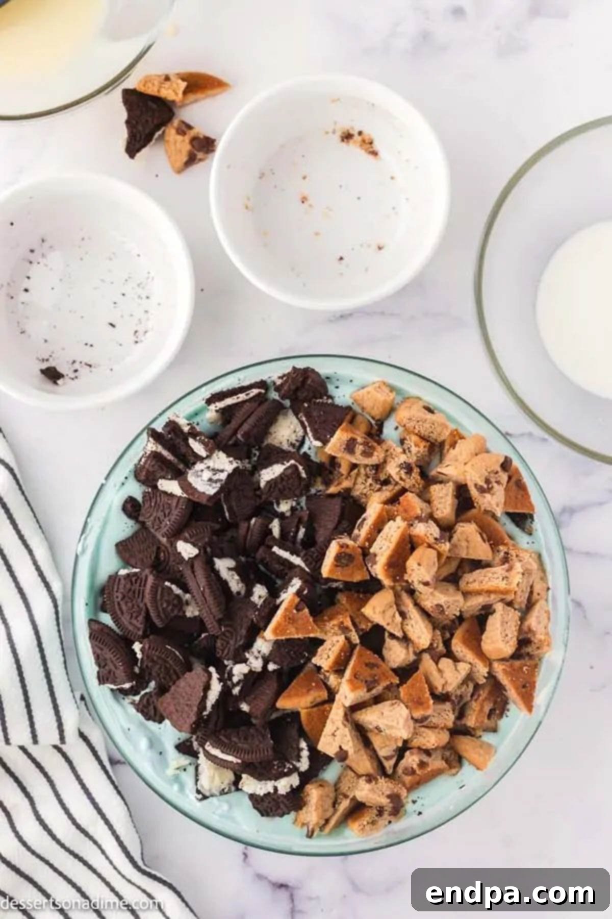 Chopped cookie pieces mixed into the blue ice cream base.