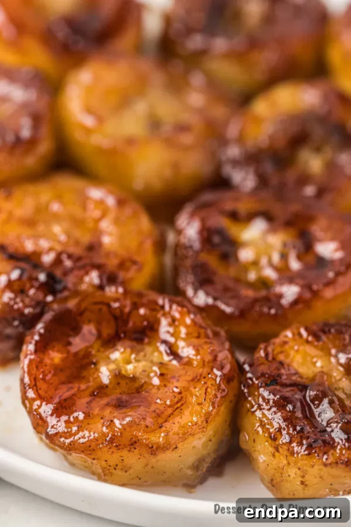 Sweet Fried Banana Delights 2 Close up photo of fried bananas, golden brown and glistening.