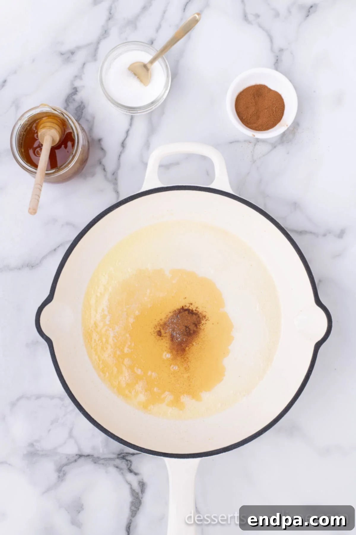 Sweet Fried Banana Delights 5 Melted butter in a hot skillet on the stove.