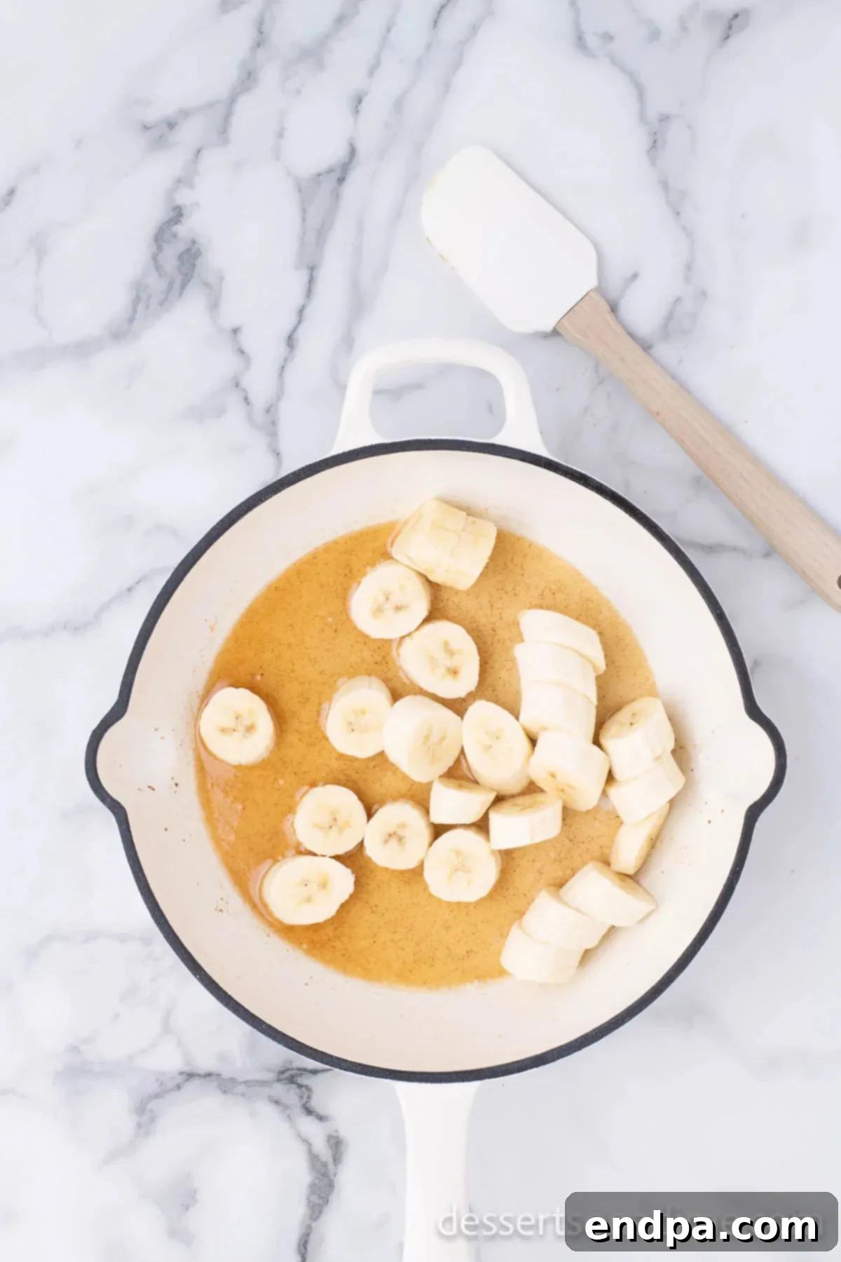 Sweet Fried Banana Delights 6 Banana slices cooking in a skillet with butter and honey.