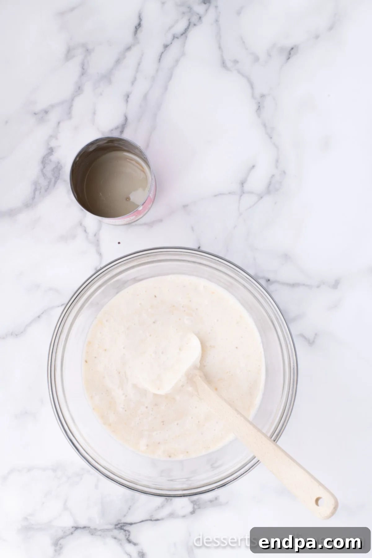 Banana Nut Fudge Frenzy 6 Separate bowl with sweetened condensed milk and bananas combined together.