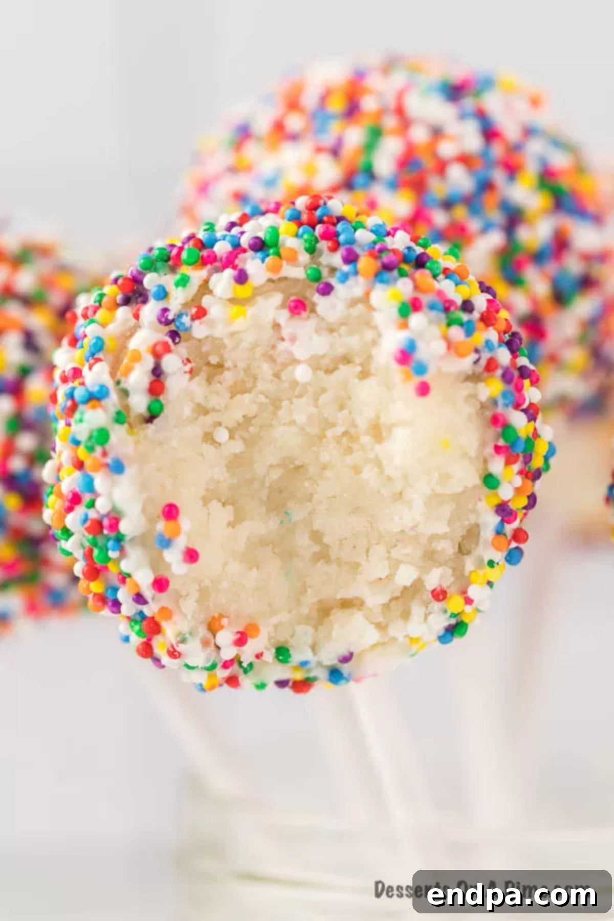 Close up photo of birthday cake pops, vibrant and festive.