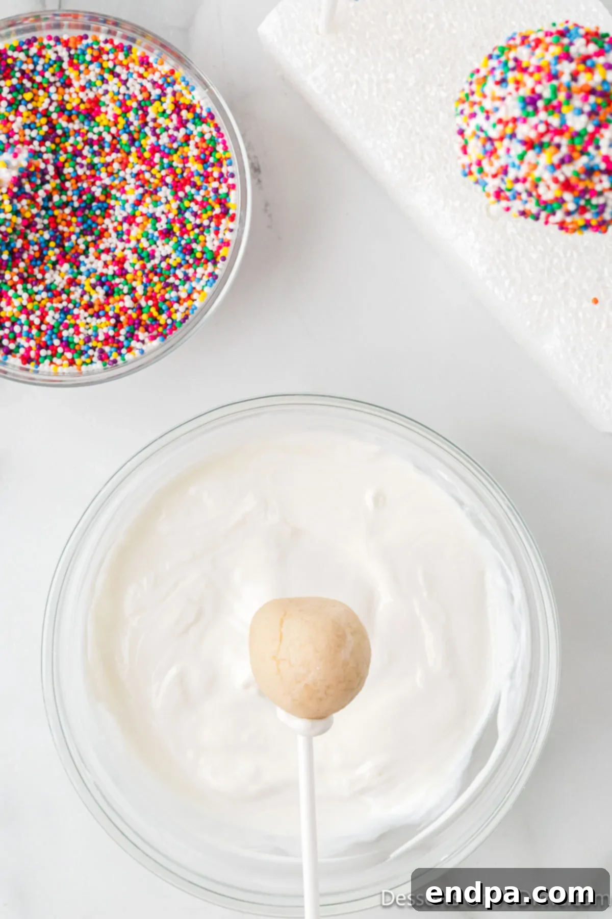 Lollipop sticks dipped in melted white candy coating.