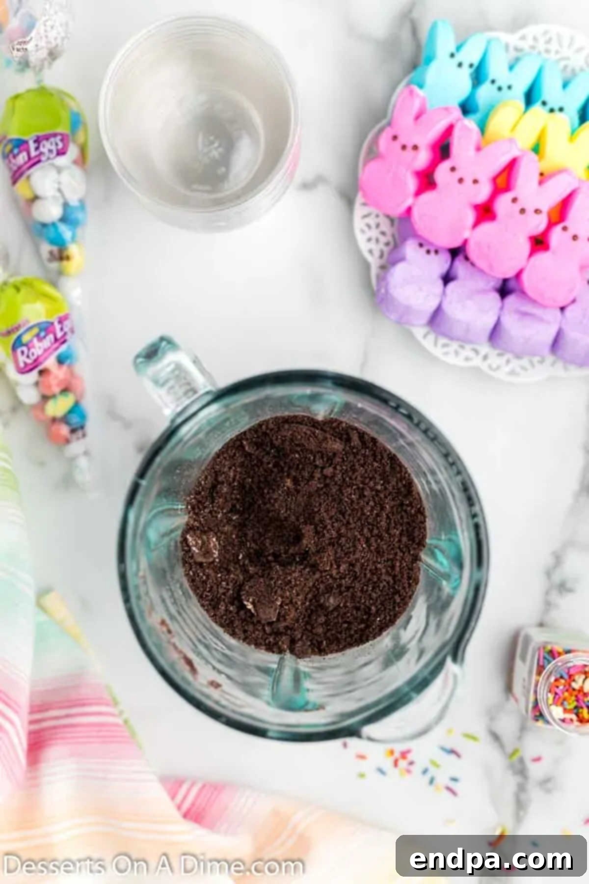 Easter Bunny Burrow Cups 7 Crushed oreo cookies in measuring cup.