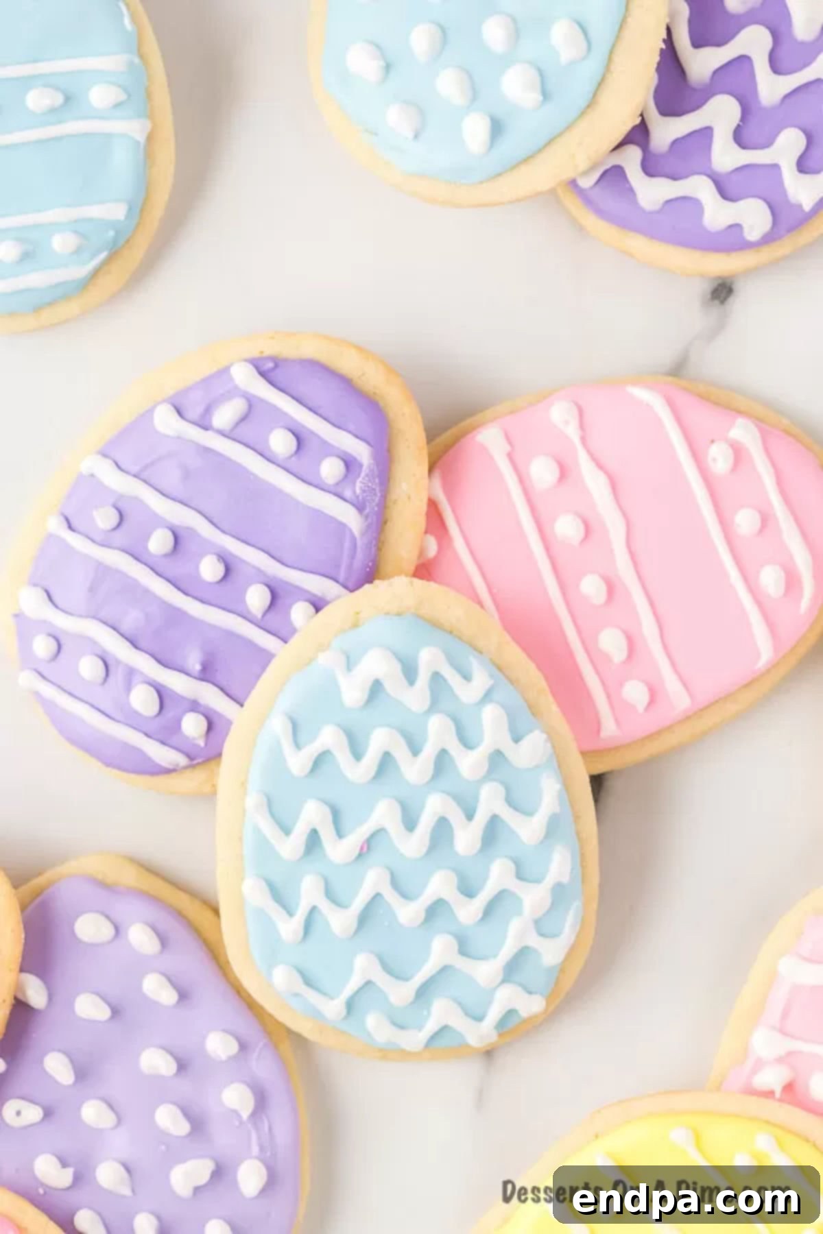 Beautifully decorated Easter egg Sugar Cookies with royal icing.