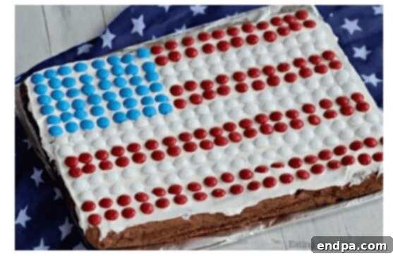 An American Flag Cookie Cake decorated with M&M's.
