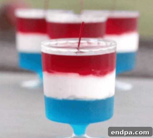 Red, White, and Blue Jello in clear cups.