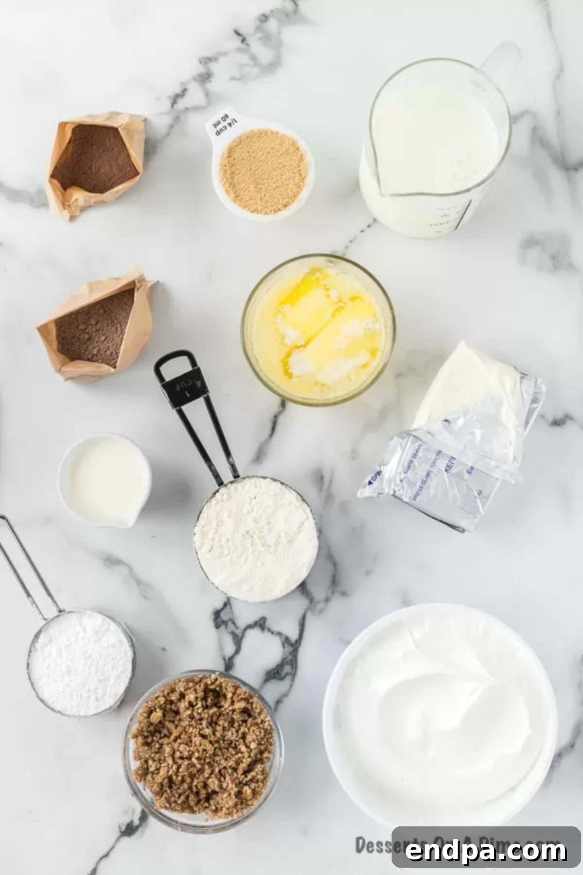 Various ingredients laid out for making possum pie: flour, butter, brown sugar, pecans, cream cheese, confectioners' sugar, heavy cream, instant chocolate pudding mixes, milk, whipped topping, and chocolate for shavings.
