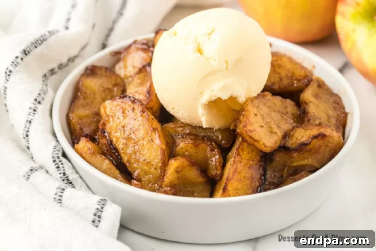 Golden Air Fryer Apple Slices 2 bowl of air fryer apples with ice cream.