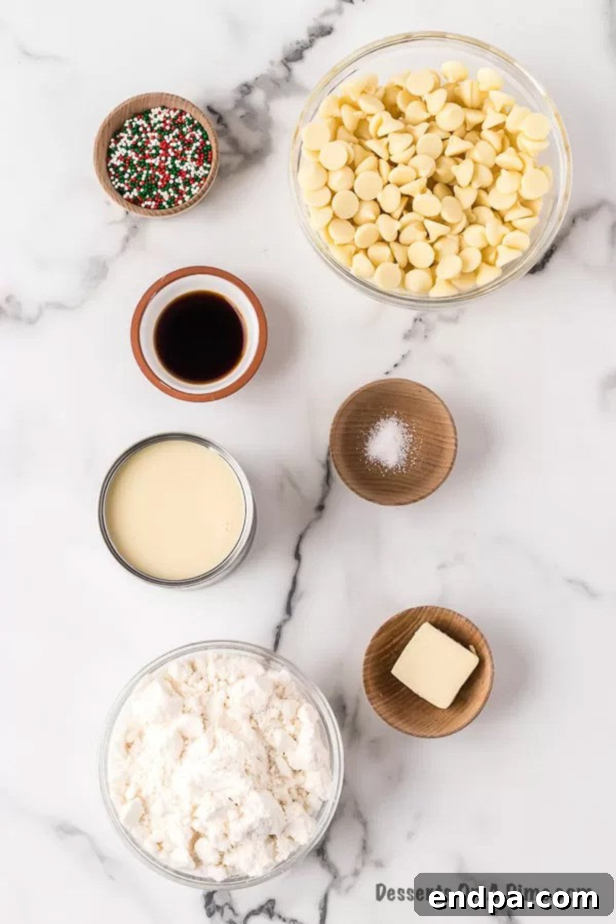 Ingredients laid out for Sugar Cookie Fudge: white chocolate chips, colorful sprinkles, sugar cookie mix, and sweetened condensed milk, ready for preparation.