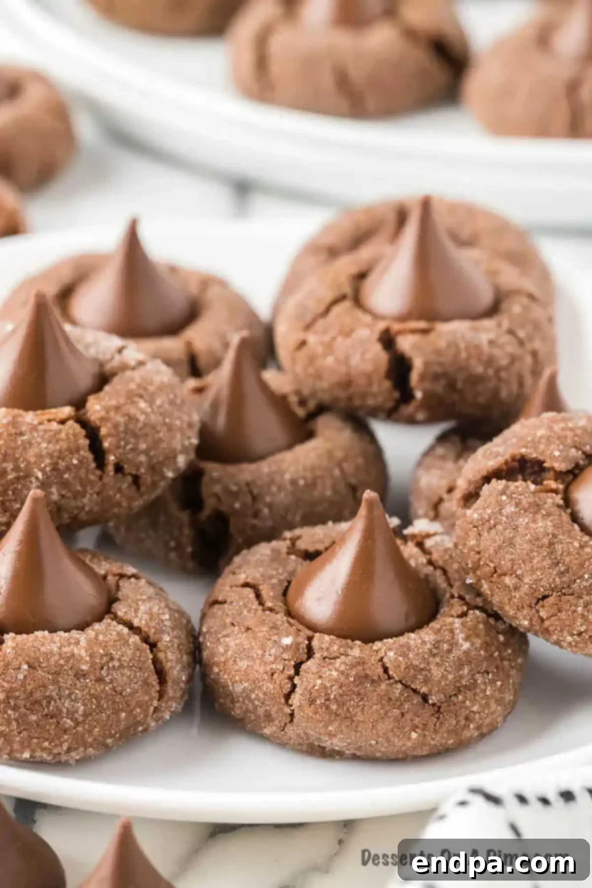 Plate of freshly baked chocolate kiss cookies, beautifully arranged and ready to be enjoyed.