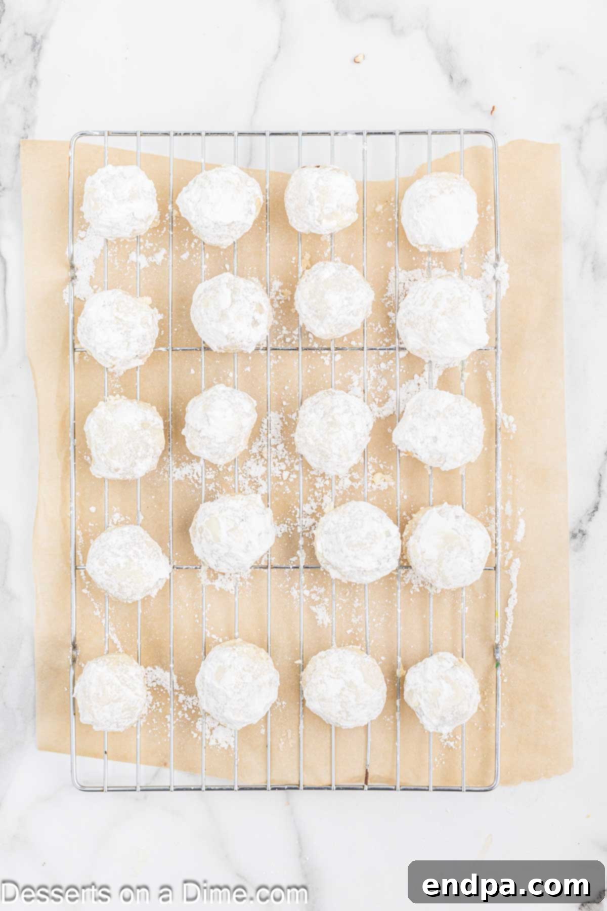 Powdered Sugar Dreams 11 Cookie dough balls placed on wire rack to cool.
