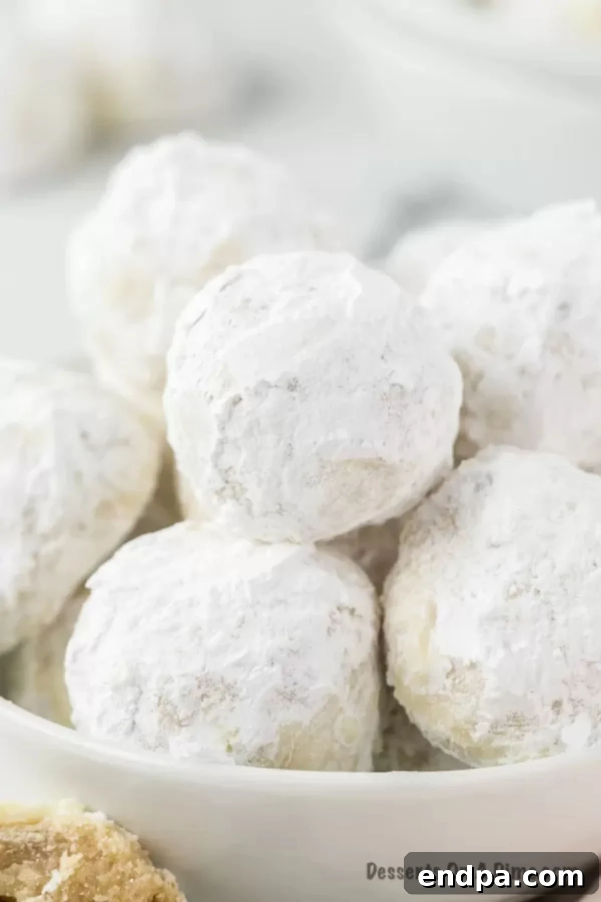 Powdered Sugar Dreams 12 Russian tea cakes in a bowl.