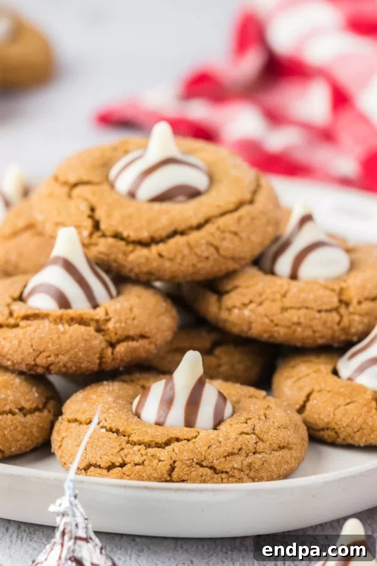 Gingerbread Kiss Cookies stacked together, perfect for a holiday display.