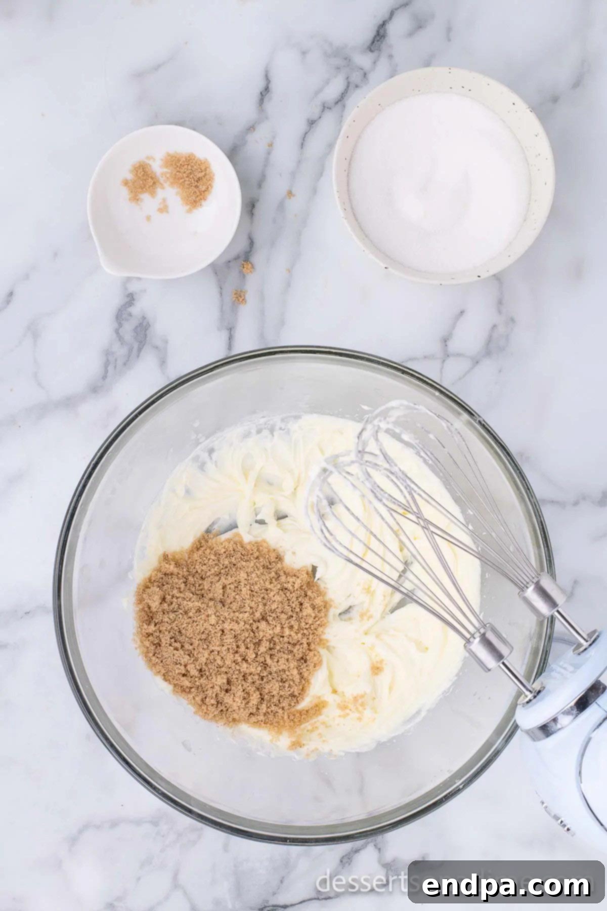 Mixing bowl with butter and sugar being creamed together.