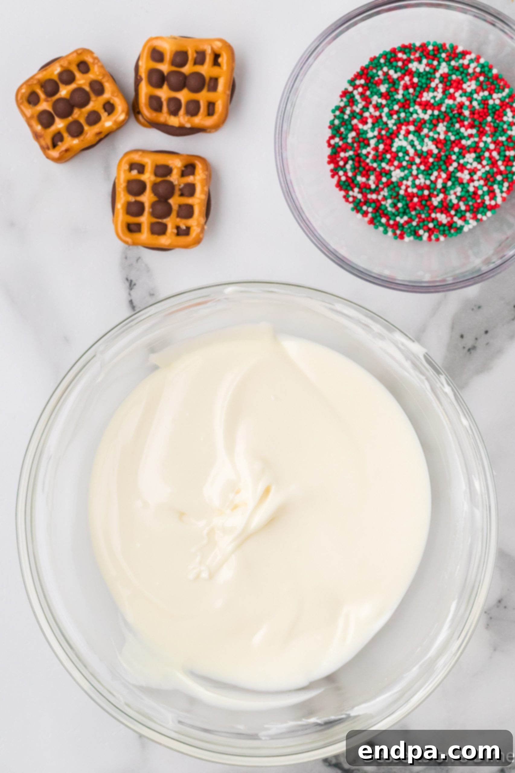 Melted white chocolate chips in a small bowl, smooth and ready for dipping.