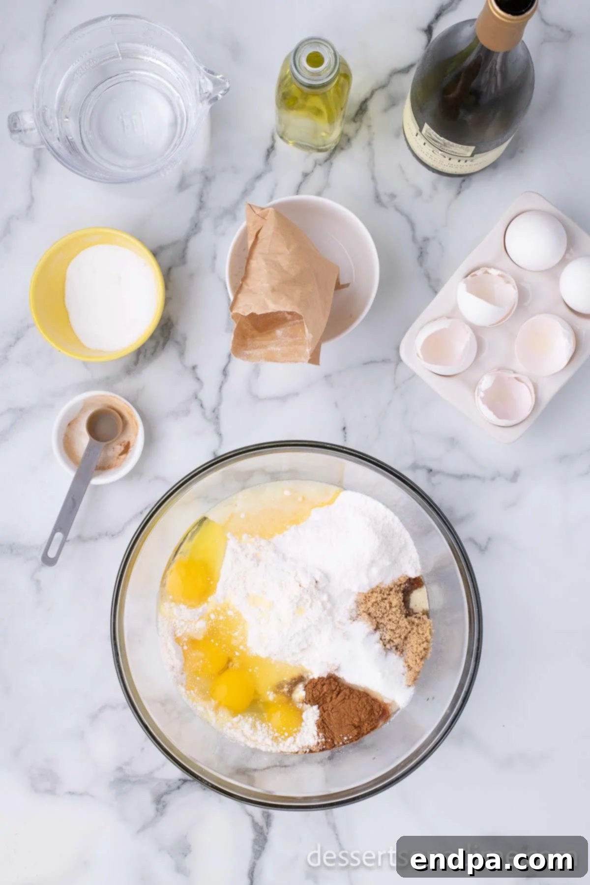 Unforgettable Craving Cake 4 Image showing cake ingredients being combined in a large mixing bowl with a stand mixer.