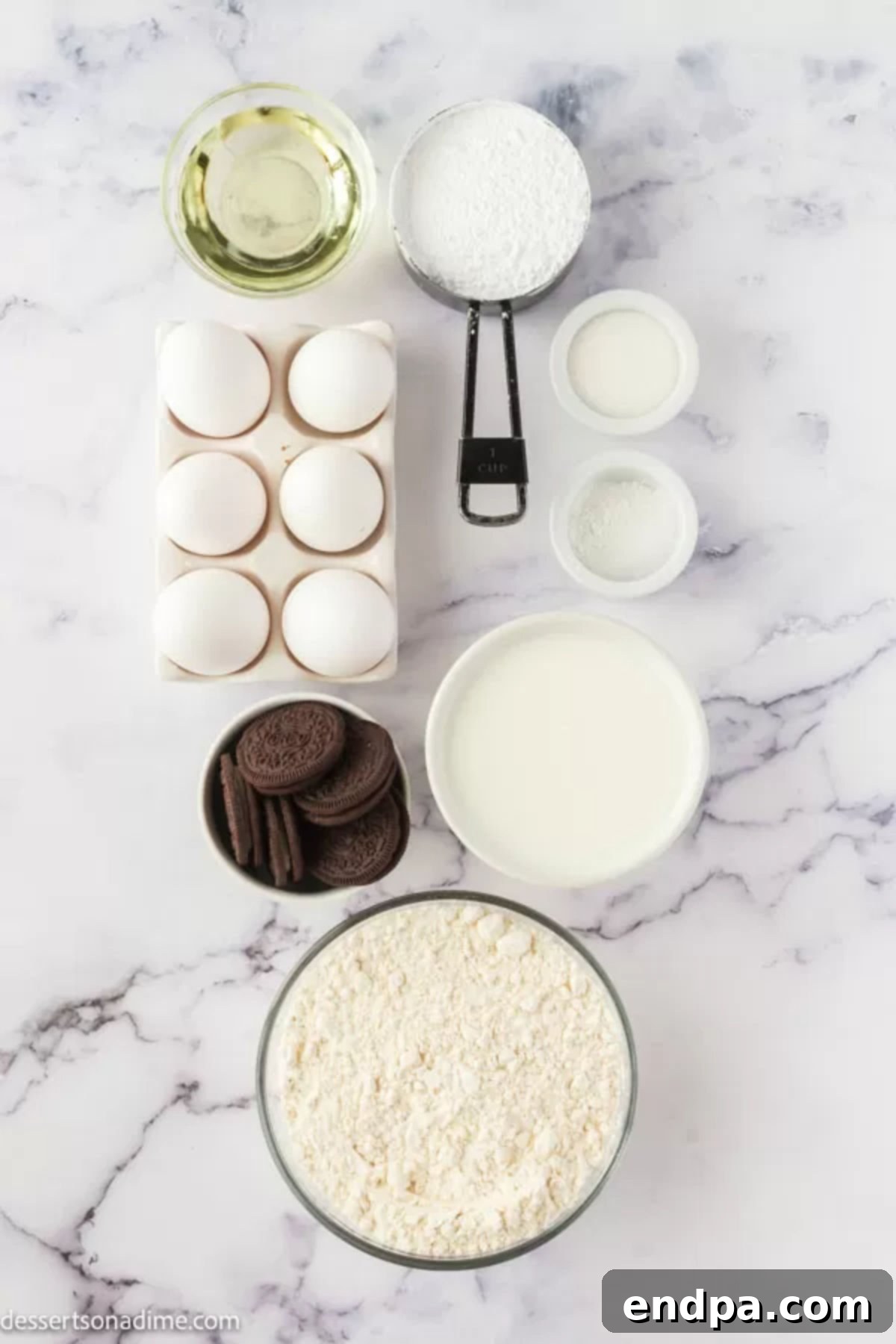 Ingredients for Oreo funnel cake laid out: flour, milk, eggs, powdered sugar, vanilla ice cream, whipped cream, and Oreo cookies.