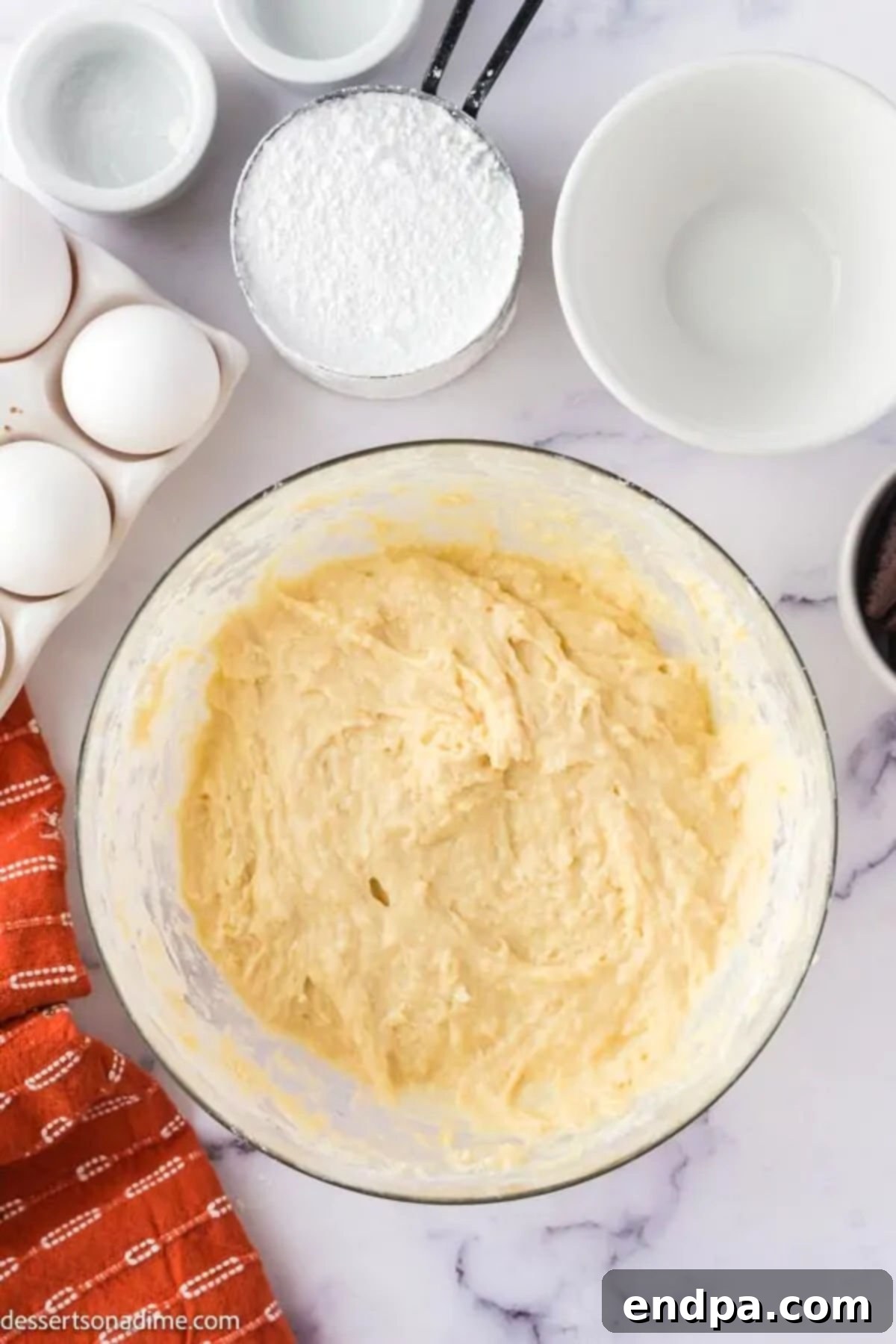 Smooth funnel cake batter ready for frying.