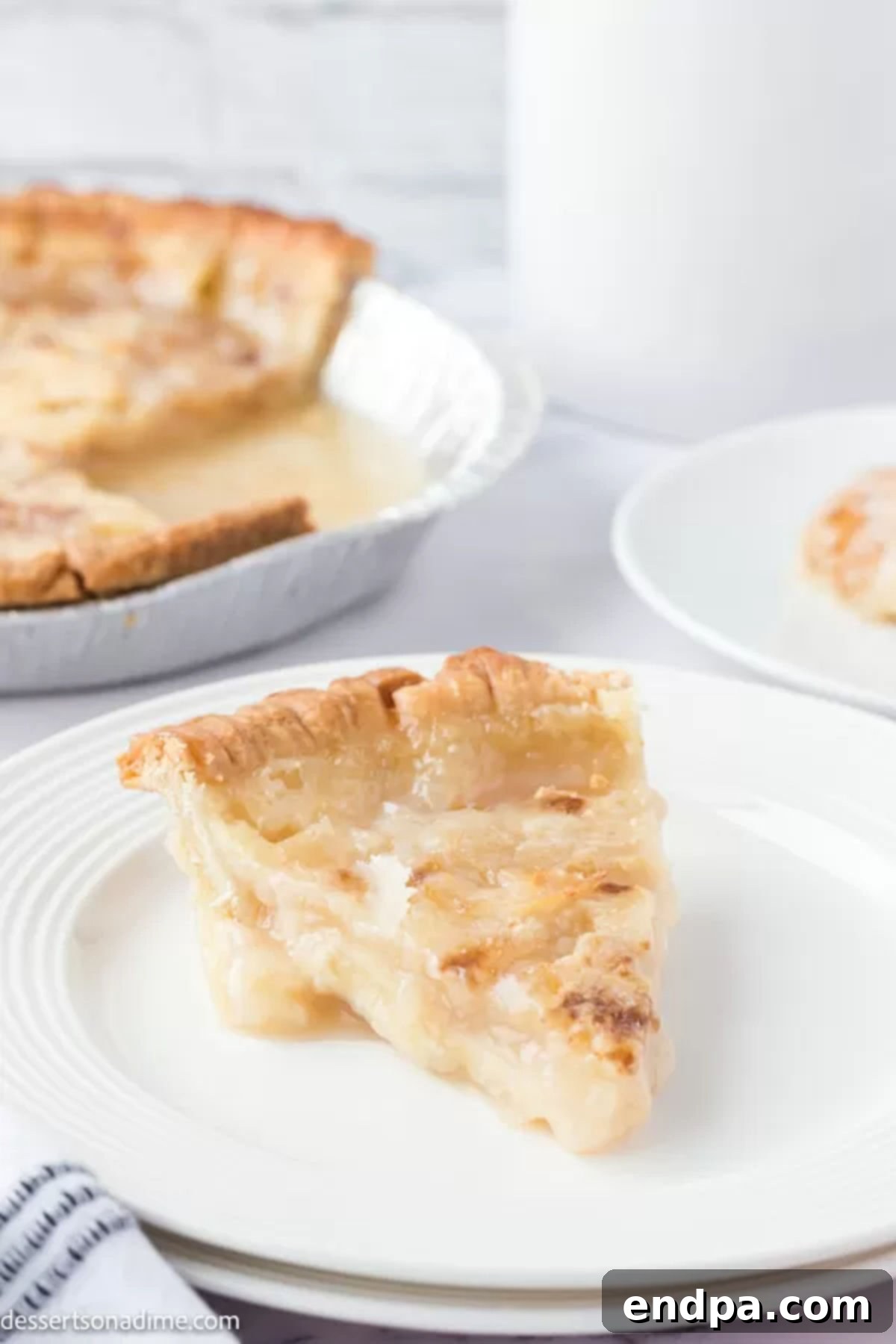 A delicious slice of Sprite pie on a plate, showing its gooey, caramelized center and golden crust, ready to be eaten.