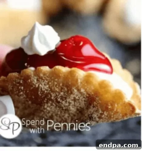 Cheesecake Dessert Tacos filled with creamy cherry cheesecake and topped with whipped cream.