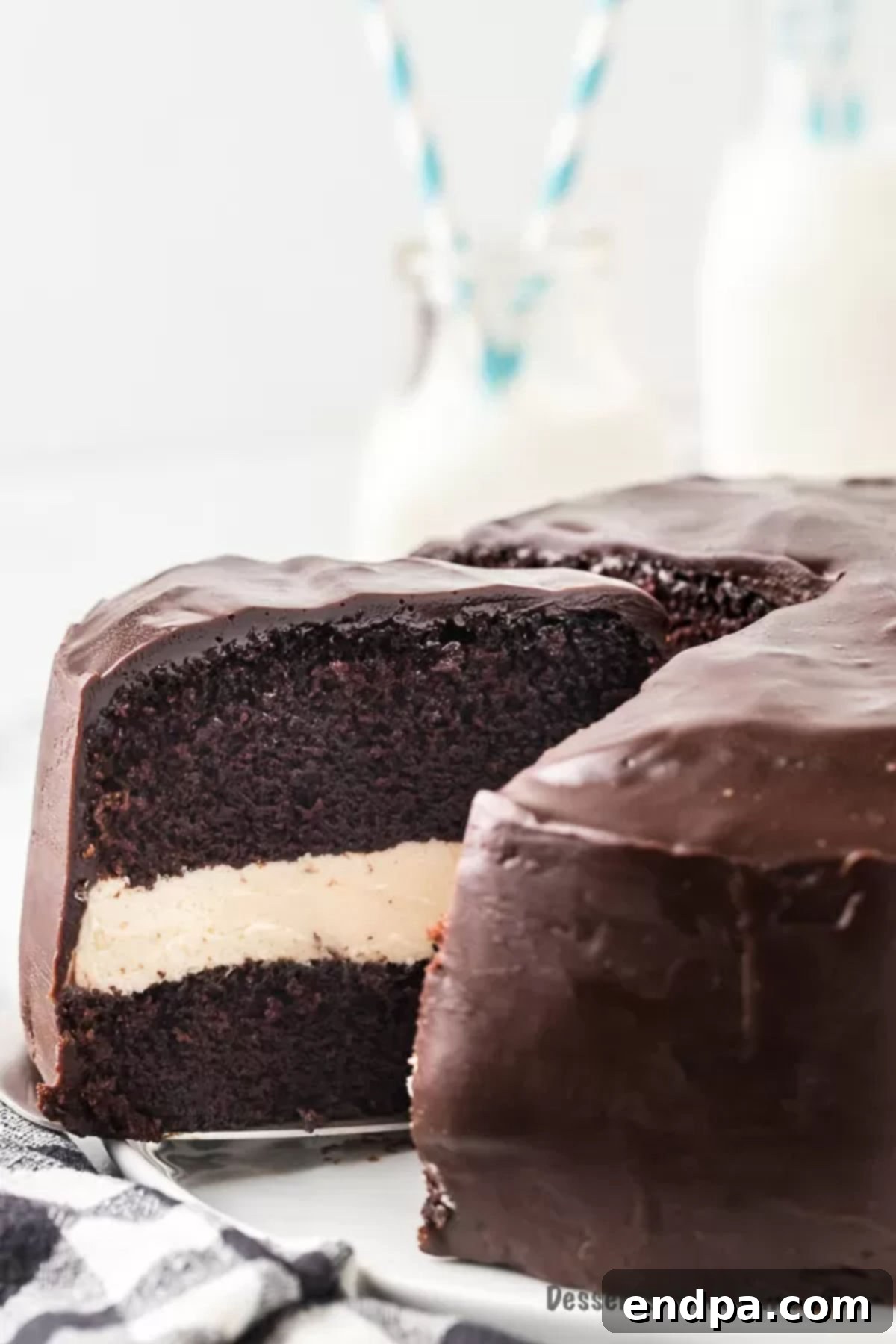 Birthday Cake Longevity: A Freshness Guide 3 Close up image of a decadent Ding Dong cake on a platter, showcasing its rich chocolate and cream layers.