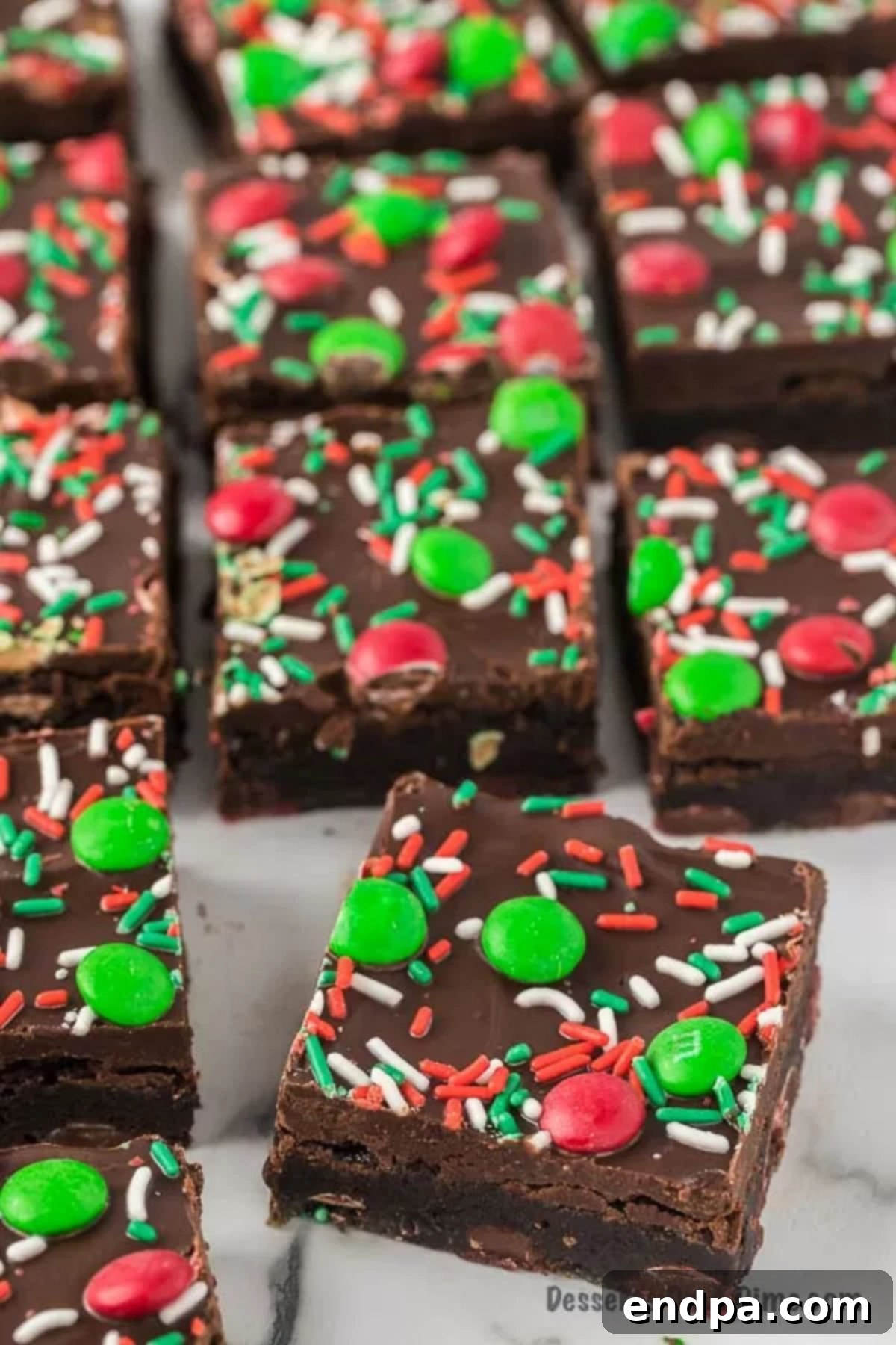Merry & Bright Brownies 2 Christmas Brownies cut into squares and decorated with festive sprinkles.