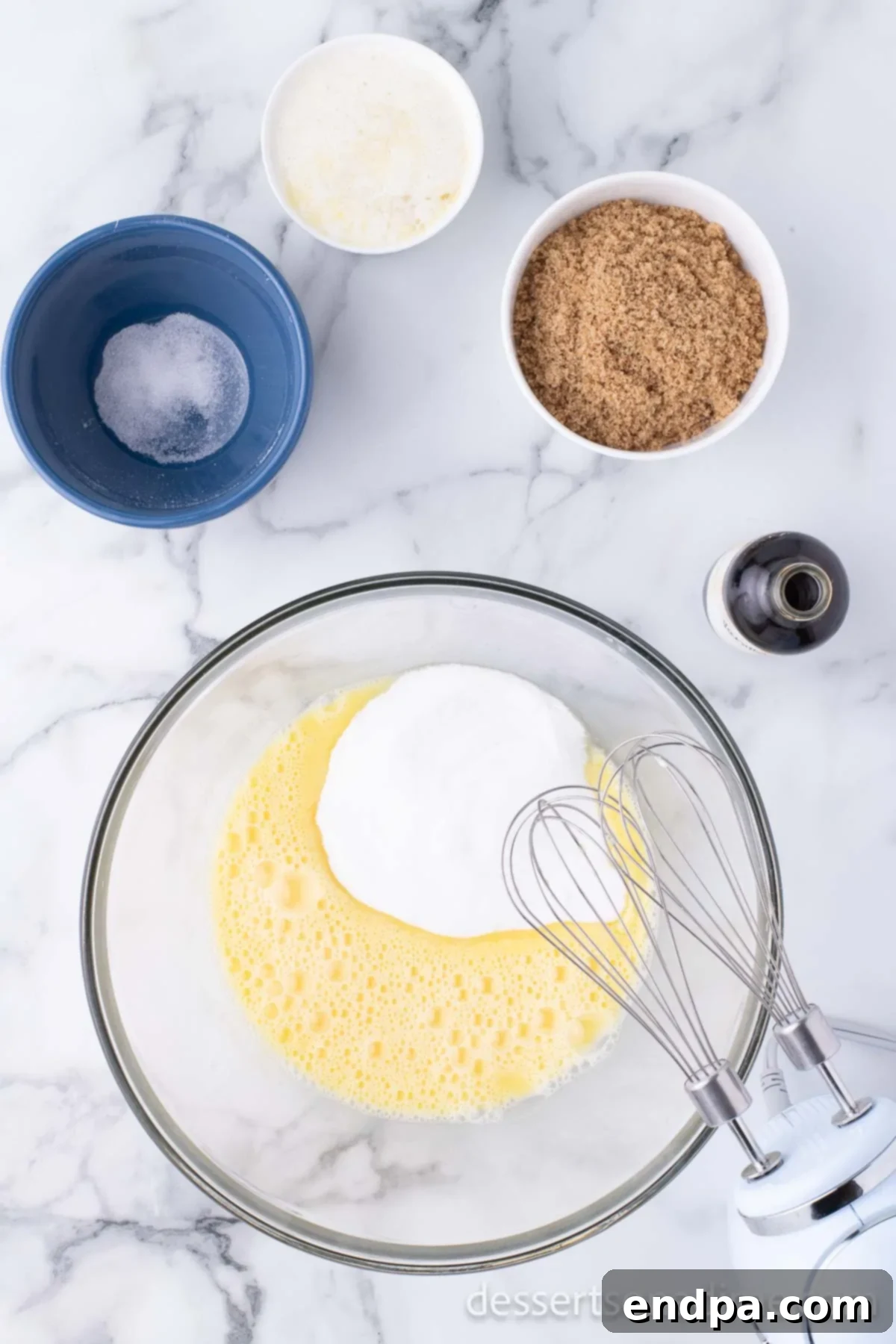 Merry & Bright Brownies 5 Mixing bowl with butter, sugar, and eggs being combined.